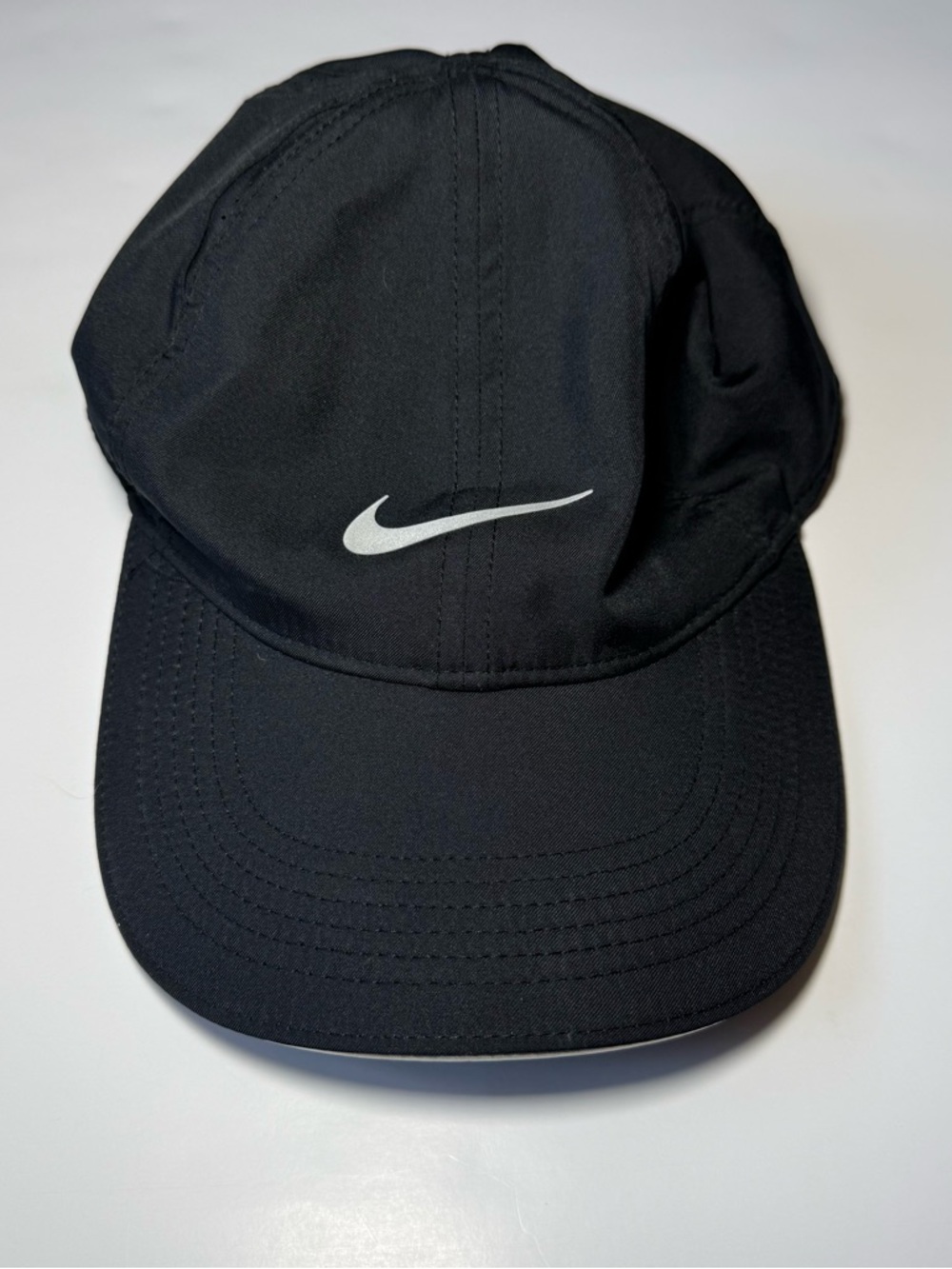 Nike Black Featherlight Dri-FIT Performance Cap with White Swoosh - Picture 1 of 7